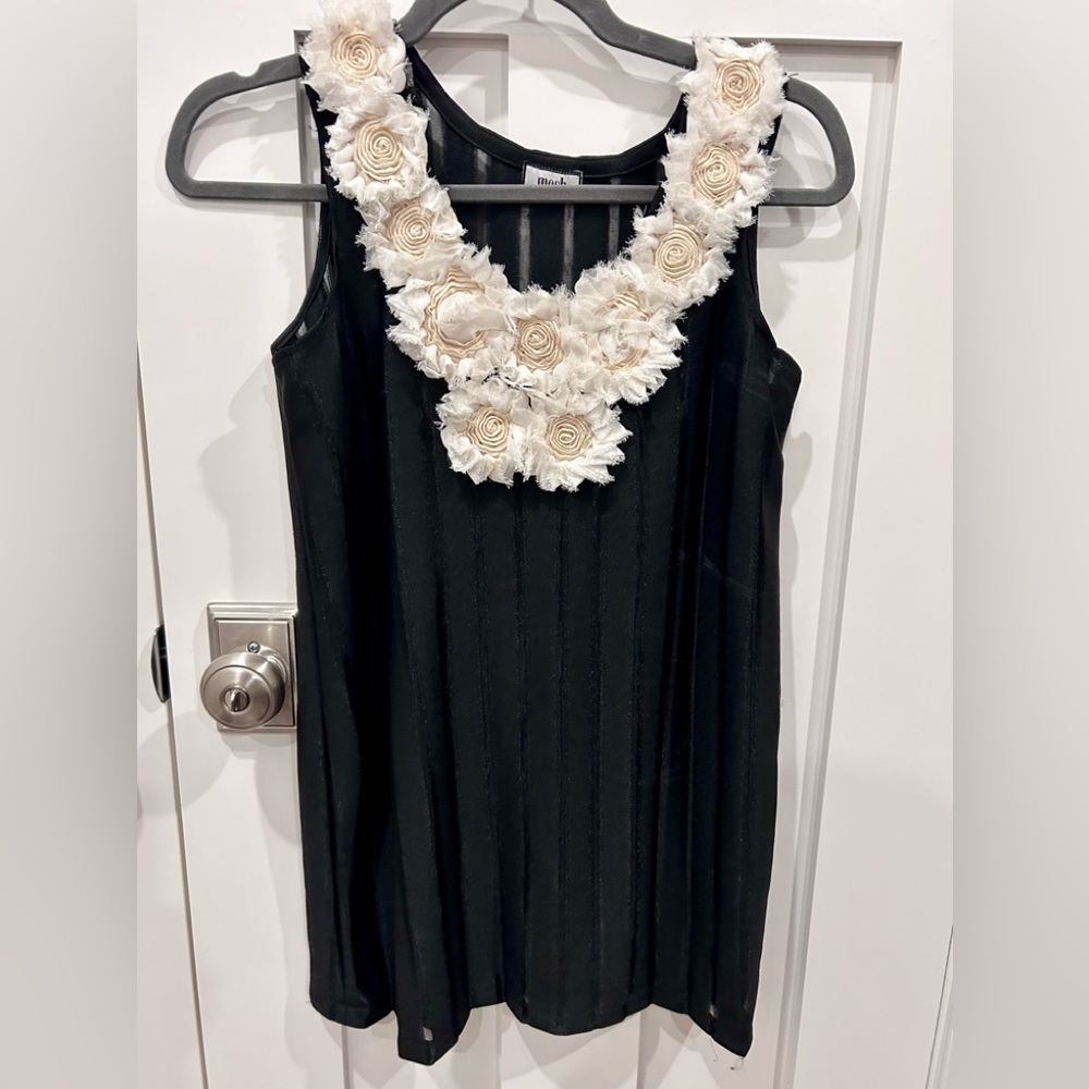 Gorgeous black sleeveless top with cream, chiffon-like flowers